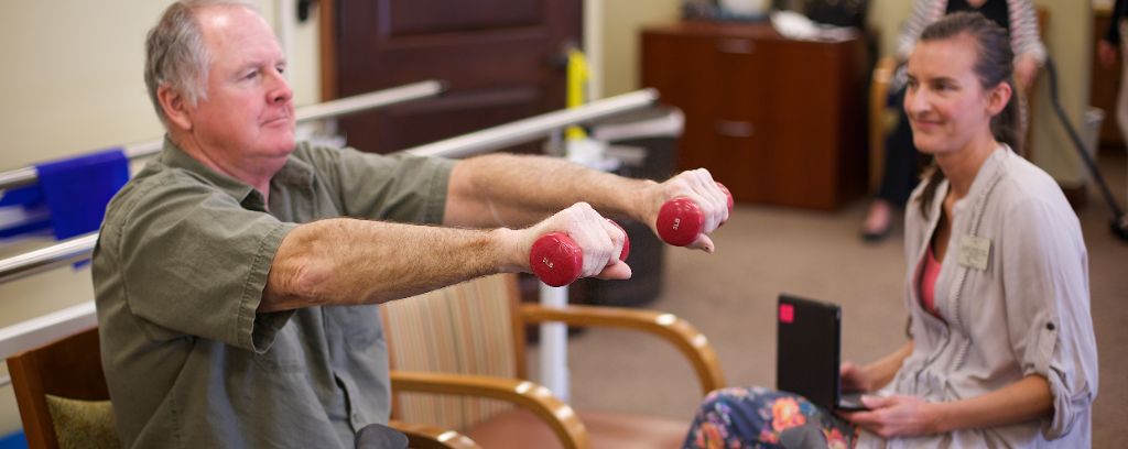 Highly rated rehabilitation session with resident lifting weights