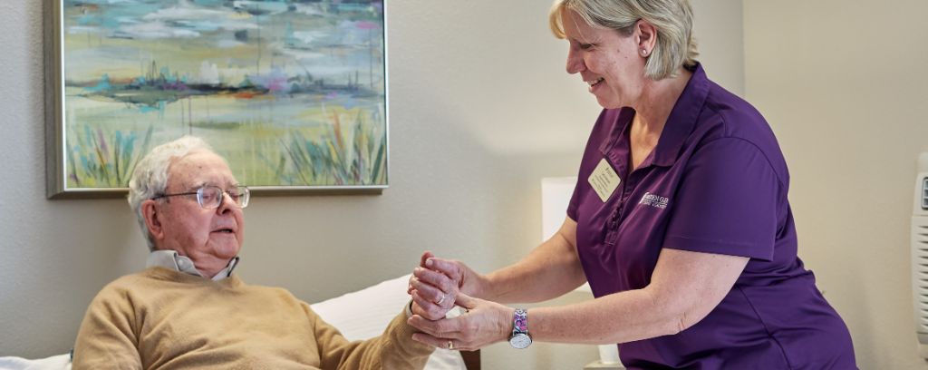 Nurse checking residents pulse