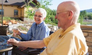 Residents enjoying wine on Caseys Ponds patio