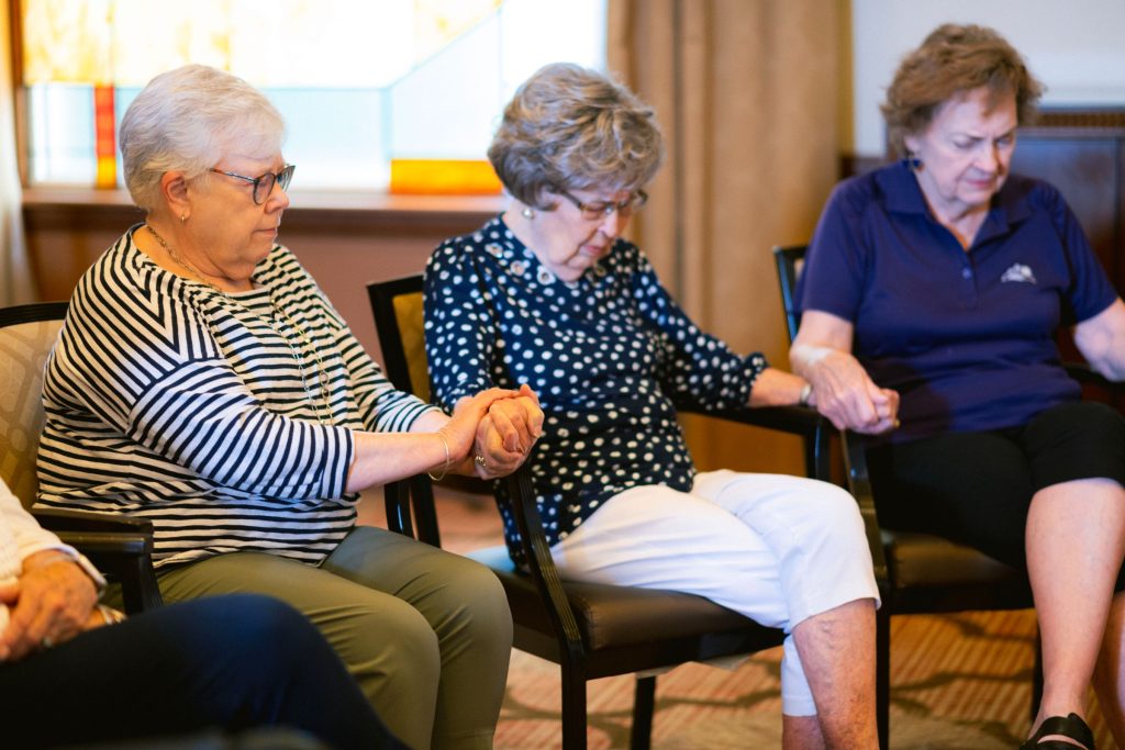 Clermont Park residents in prayer
